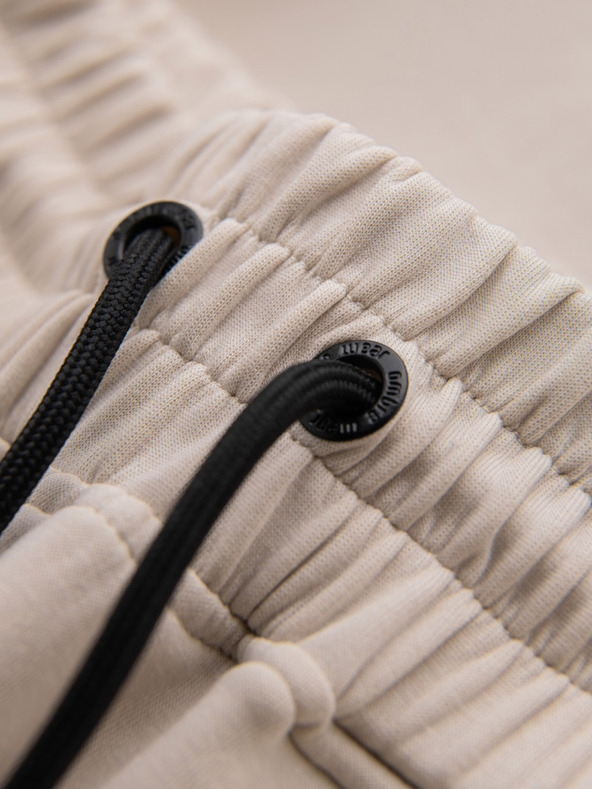 Ombre Clothing Мъжки спортни панталони с оребрени маншети и декоративен цип - пясъчен Ombre Clothing